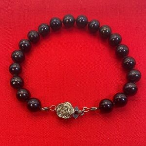 Elegant Black Beaded Bracelet with Silver Rose Clasp